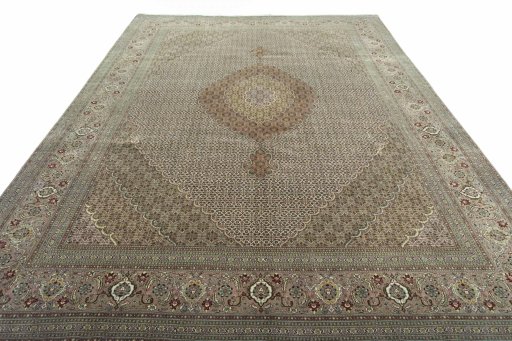 Surface texture of 2000s Tabriz rug with natural Cork and intricate pattern