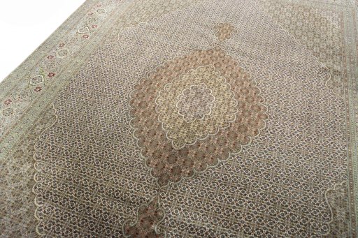 Backside of handmade 2000s Tabriz rug showing knot structure and weave density