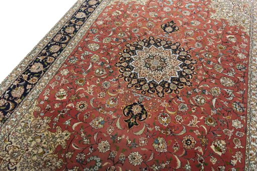 Backside of handmade New Tabriz rug showing knot structure and weave density
