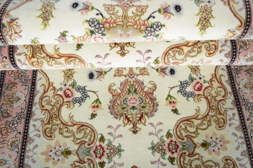 Corner detail of New Tabriz rug showing border pattern and Cork pile