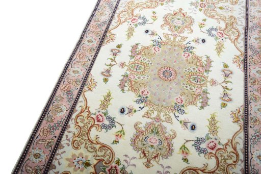 Backside of handmade New Tabriz rug showing knot structure and weave density