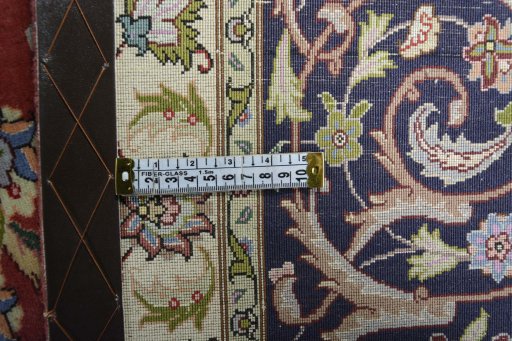 Backside of handmade New Tabriz rug showing knot structure and weave density