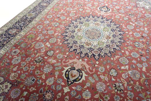Backside of handmade New Tabriz rug showing knot structure and weave density