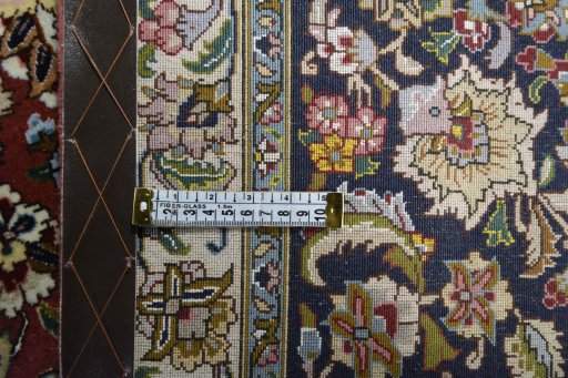 Backside of handmade New Tabriz rug showing knot structure and weave density