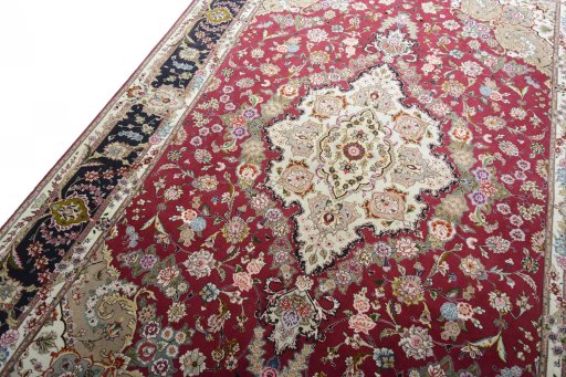 Backside of handmade New Tabriz rug showing knot structure and weave density