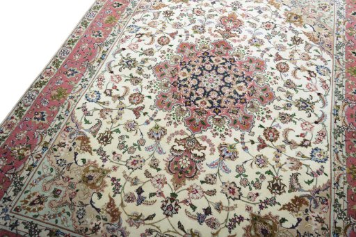 Backside of handmade New Tabriz rug showing knot structure and weave density