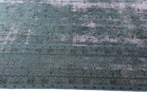 Corner detail of 1970s Tabriz rug showing border pattern and Wool pile