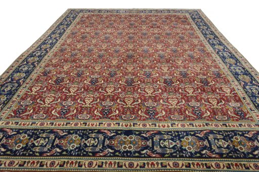 Surface texture of 2000s Tabriz rug with natural Wool and intricate pattern