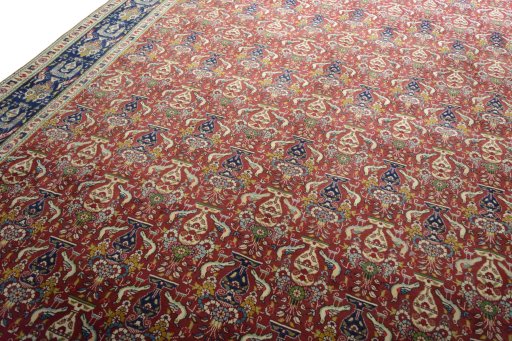 Backside of handmade 2000s Tabriz rug showing knot structure and weave density