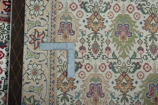 Close-up detail of 2000s Tabriz rug from Iran / Persia showing Wool weave