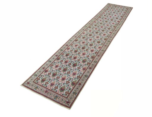 Corner detail of 2000s Tabriz rug showing border pattern and Wool pile