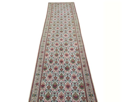 Surface texture of 2000s Tabriz rug with natural Wool and intricate pattern