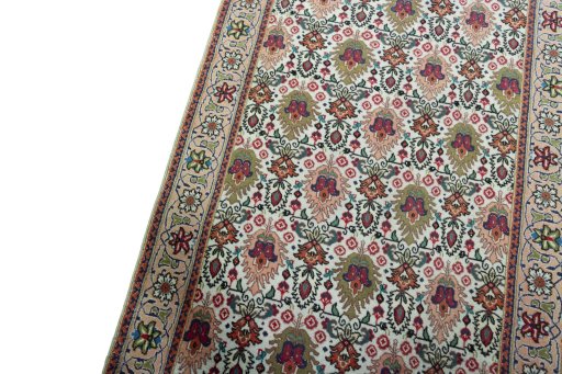 Backside of handmade 2000s Tabriz rug showing knot structure and weave density