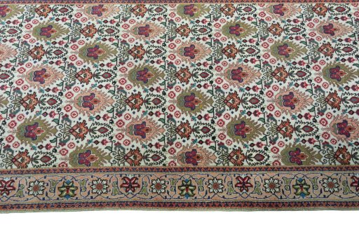 Close-up detail of 2000s Tabriz rug from Iran / Persia showing Wool weave