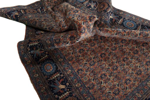 Corner detail of 1930s Tabriz rug showing border pattern and Wool pile