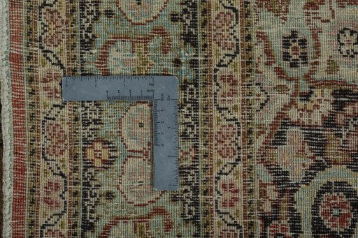 Backside of handmade 1930s Tabriz rug showing knot structure and weave density