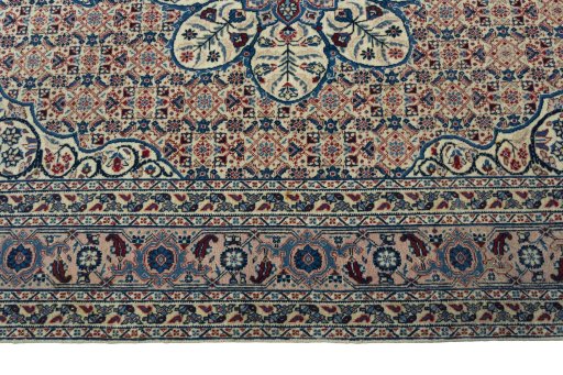 Corner detail of 1950s Tabriz rug showing border pattern and Wool pile