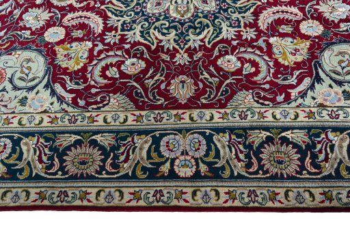 Corner detail of 2000s Tabriz rug showing border pattern and Wool pile
