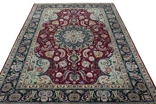 Surface texture of 2000s Tabriz rug with natural Wool and intricate pattern