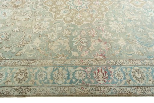 Corner detail of 1950s Tabriz rug showing border pattern and Wool pile