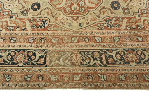 Corner detail of 1930s Tabriz rug showing border pattern and Wool pile