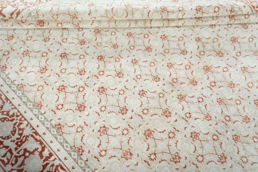Corner detail of 2000s Tabriz rug showing border pattern and Wool pile