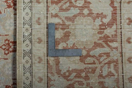 Surface texture of 2000s Tabriz rug with natural Wool and intricate pattern