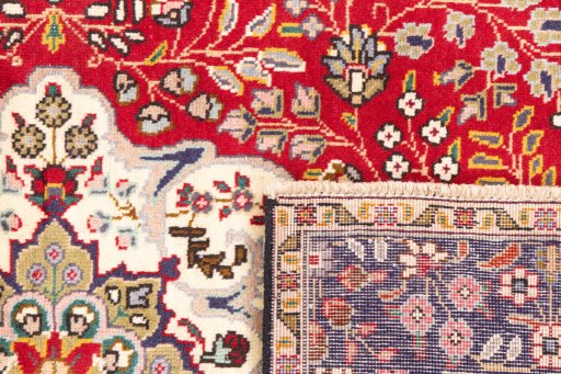 Close-up detail of 1980s Tabriz rug from Iran / Persia showing Wool weave