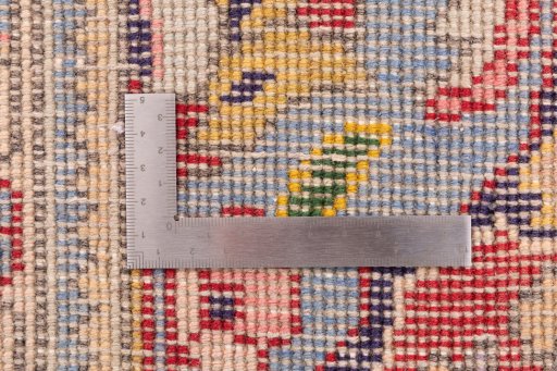 Corner detail of 2003s Tabriz rug showing border pattern and Wool pile