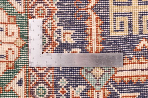 Corner detail of 1970s Tabriz rug showing border pattern and Wool pile