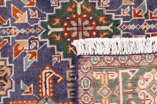 Close-up detail of 1970s Tabriz rug from Iran / Persia showing Wool weave