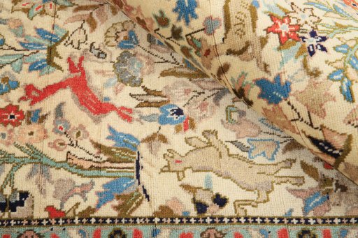 Corner detail of 2000s Tabriz rug showing border pattern and Wool pile