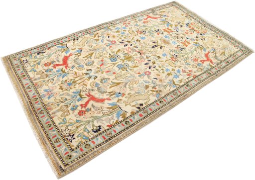 Corner detail of 2000s Tabriz rug showing border pattern and Wool pile