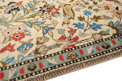 Backside of handmade 2000s Tabriz rug showing knot structure and weave density