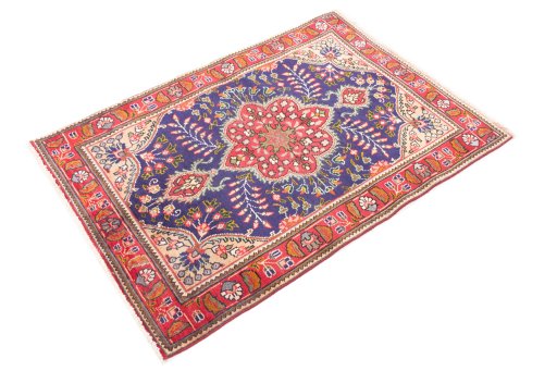 Corner detail of 1996s Tabriz rug showing border pattern and Wool pile