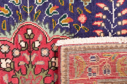 Close-up detail of 1996s Tabriz rug from Iran / Persia showing Wool weave