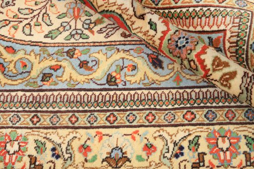 Close-up detail of 1990s Tabriz rug from Iran / Persia showing Wool weave