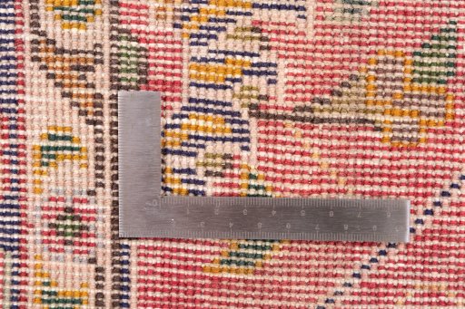 Corner detail of 1980s Tabriz rug showing border pattern and Wool pile