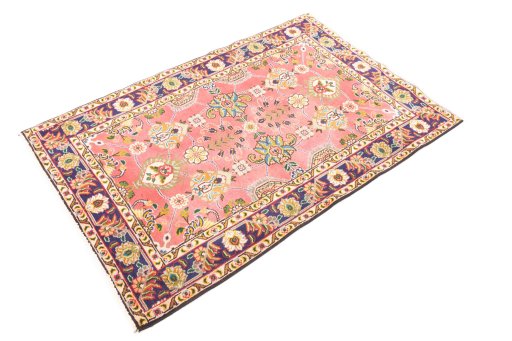 Corner detail of 1980s Tabriz rug showing border pattern and Wool pile