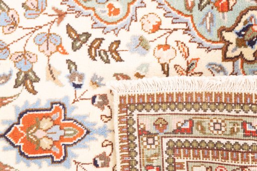 Close-up detail of 2005s Tabriz rug from Iran / Persia showing Wool weave