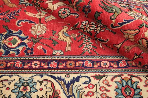 Surface texture of 2000s Tabriz rug with natural Wool and intricate pattern