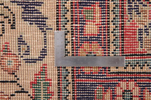 Backside of handmade 2000s Tabriz rug showing knot structure and weave density