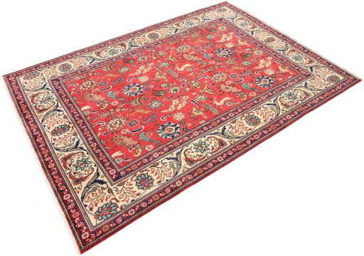 Corner detail of 2000s Tabriz rug showing border pattern and Wool pile