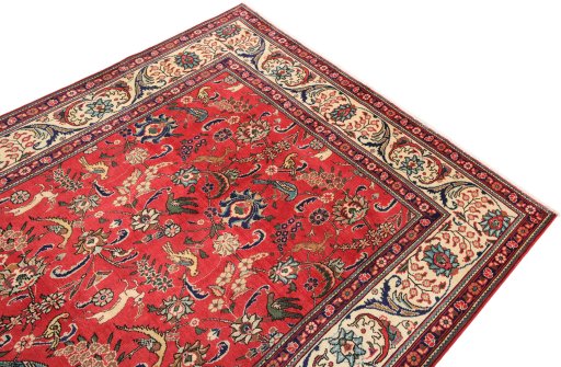 Surface texture of 2000s Tabriz rug with natural Wool and intricate pattern