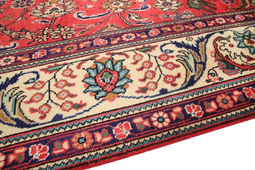 Backside of handmade 2000s Tabriz rug showing knot structure and weave density