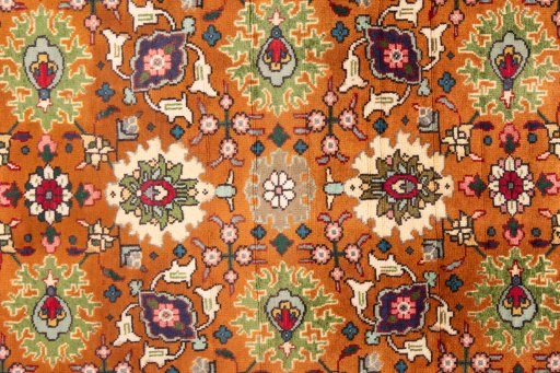 Close-up detail of 1999s Tabriz rug from Iran / Persia showing Wool weave