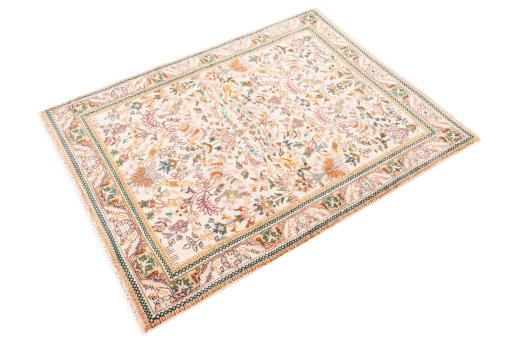 Corner detail of 1975s Tabriz rug showing border pattern and Wool pile