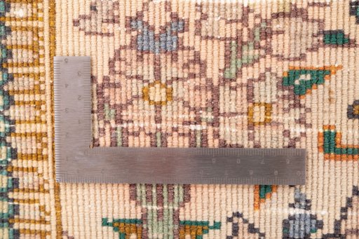 Corner detail of 1975s Tabriz rug showing border pattern and Wool pile