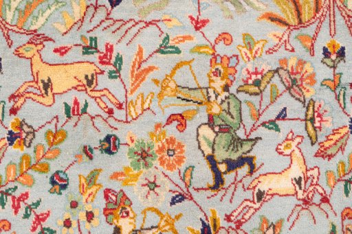 Corner detail of 2003s Tabriz rug showing border pattern and Wool pile