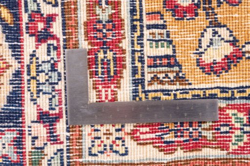 Close-up detail of 2005s Tabriz rug from Iran / Persia showing Wool weave